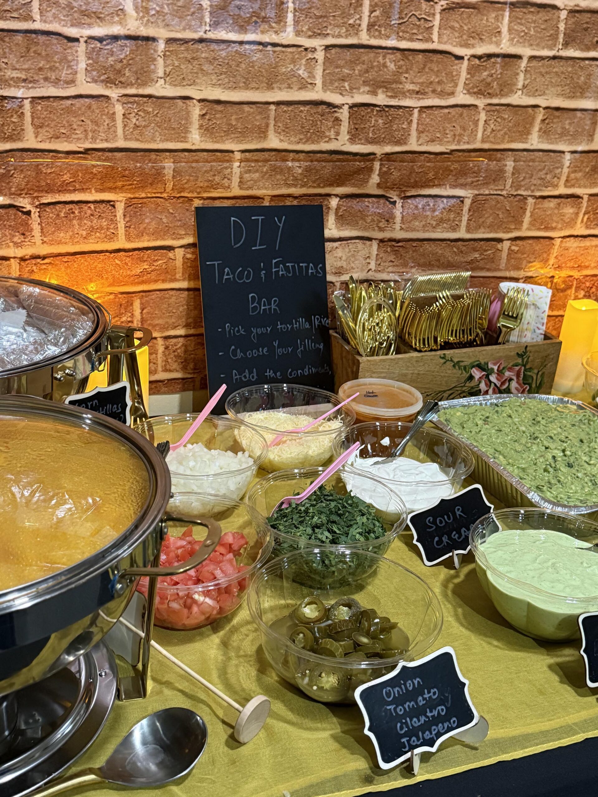 catering table with guac, onion, tomato, cilantro & jalapeno